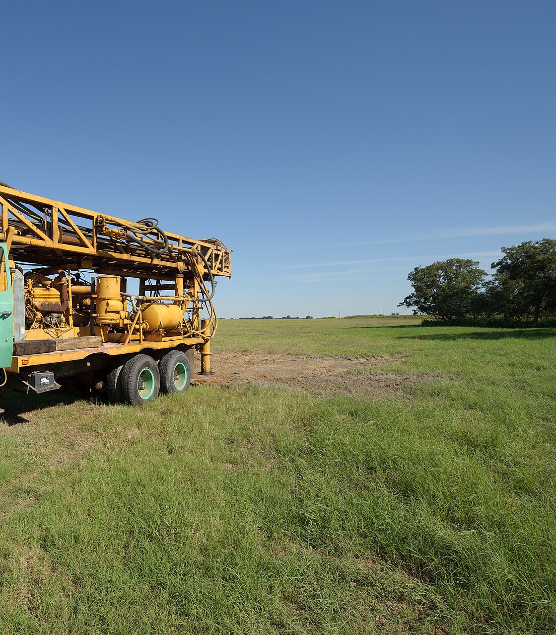 The deck of a water well drilling rig set up on an open site